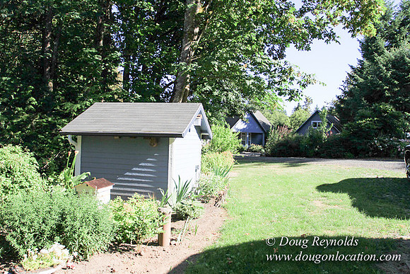 Traditional Style Home small farm with large kitchen great room, 2 story, 2 car garage on Acreage with large back yard, large front yard, garden, pond, deck, goats, bees, shop, PDX Zone