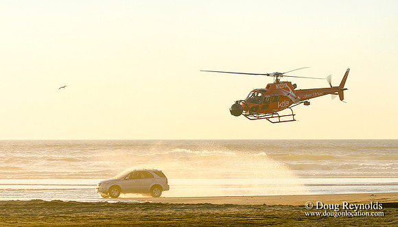 Helicopter film car on Beach