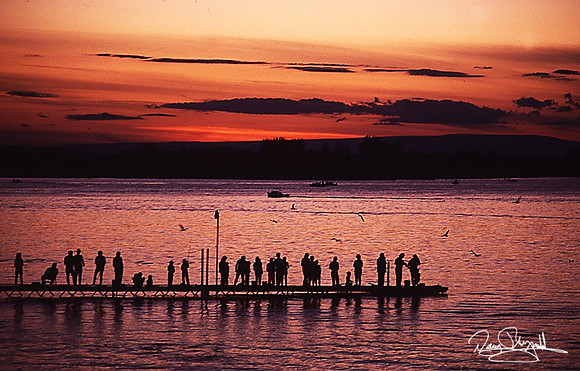 Sunset on the Washington Coast with people on Dock