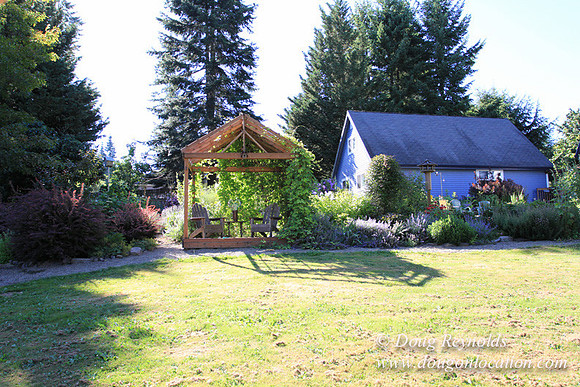 Traditional Style Home small farm with large kitchen great room, 2 story, 2 car garage on Acreage with large back yard, large front yard, garden, pond, deck, goats, bees, shop, PDX Zone