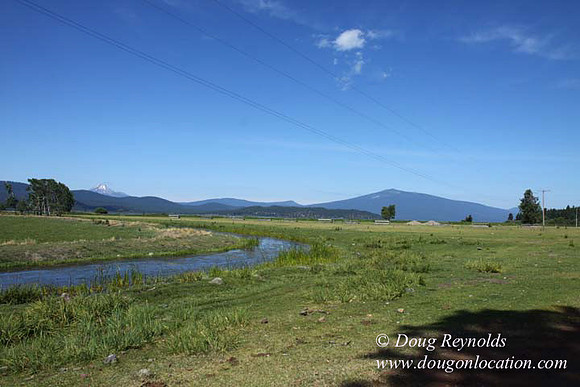 2500 Acres of green fields Creeks water crossing Bridges on a Large Lake and miles of Dirt roads Oak trees Forest land ATV Trails cows