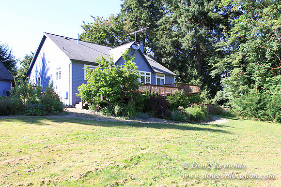 Traditional Style Home small farm with large kitchen great room, 2 story, 2 car garage on Acreage with large back yard, large front yard, garden, pond, deck, goats, bees, shop, PDX Zone