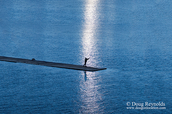 Man on dock Fishing
