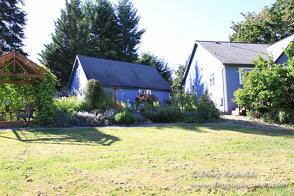 Traditional Style Home small farm with large kitchen great room, 2 story, 2 car garage on Acreage with large back yard, large front yard, garden, pond, deck, goats, bees, shop, PDX Zone