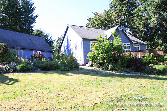 Traditional Style Home small farm with large kitchen great room, 2 story, 2 car garage on Acreage with large back yard, large front yard, garden, pond, deck, goats, bees, shop, PDX Zone