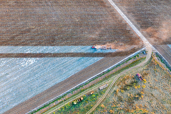 Drone over plowed fields