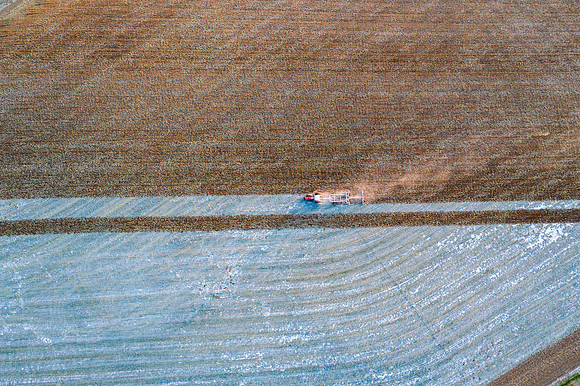 Drone over plowed fields