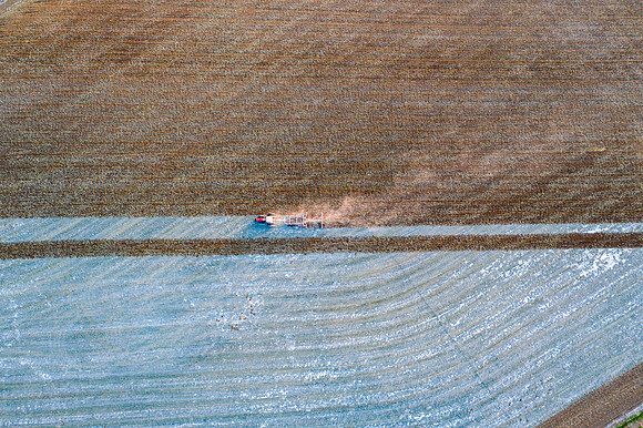 Drone over plowed fields