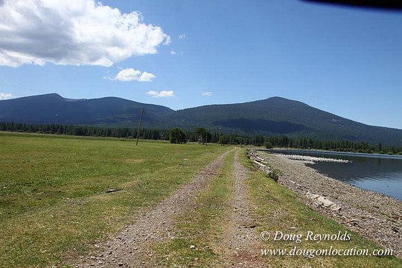 2500 Acres of green fields Creeks water crossing Bridges on a Large Lake and miles of Dirt roads Oak trees Forest land ATV Trails cows