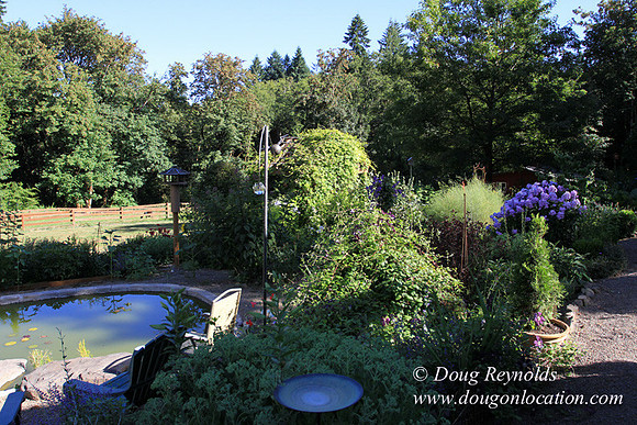 Traditional Style Home small farm with large kitchen great room, 2 story, 2 car garage on Acreage with large back yard, large front yard, garden, pond, deck, goats, bees, shop, PDX Zone