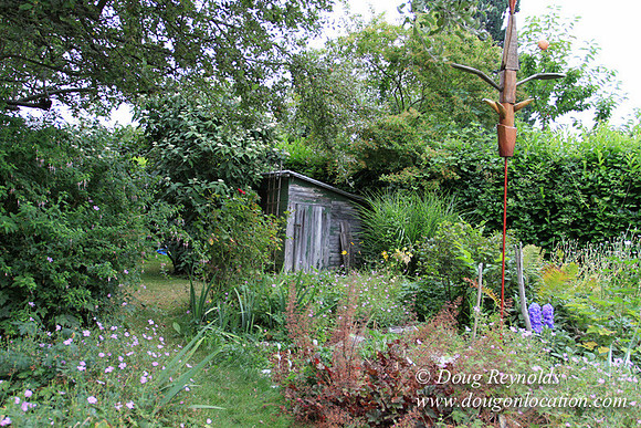 Laura’s Home This is a Portland Bungalow Style small home with a average sized and interesting back yard, nice garden with bee hive’s
