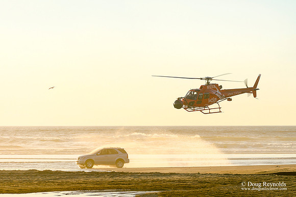 Helicopter film car on Beach