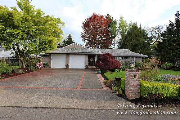 Mid Century Traditional Style Home, With a Basement, 2 car garage average sized Back Yard with Patio.