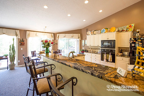 The house is a beautiful newer traditional with large rooms and lots of windows. Modern kitchen and great room, large master suite, large entry with French doors.